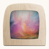 Toverlux emberfall silhouette by Berit Strasser a oil pastel style of 2 angels in the sky. Shows silhouette in a wooden frame