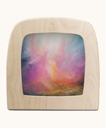 Toverlux emberfall silhouette by Berit Strasser a oil pastel style of 2 angels in the sky. Shows silhouette in a wooden frame