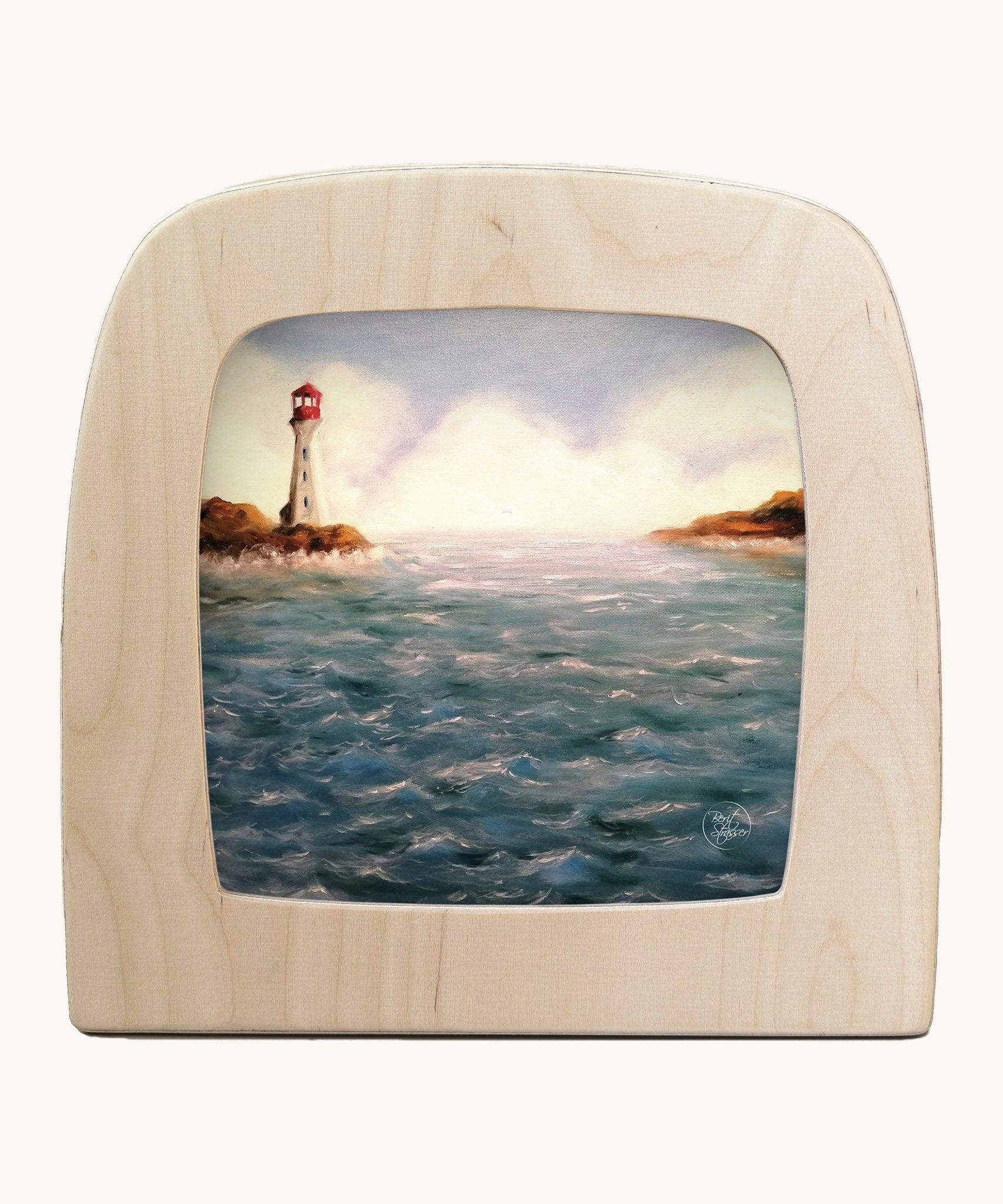 Toverlux lighthouse silhouette by Berit Strasser a oil pastel style of a lighthouse and the ocean. Shows silhouette in a wooden frame