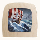 Toverlux vikign ship silhouette by Berit Strasser a oil pastel style of a viking ship and the ocean. Shows silhouette in a wooden frame