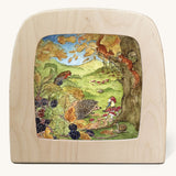 Toverlux Magic Lamp Silhouette - with a Autumn gnome Artwork By Eentje Van Margo available at Babipur. A woodland illustration with a sitting gnome looking at a hedgehog with squirrels up in a tree.