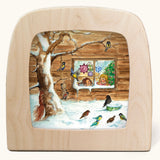 Toverlux Magic Lamp Silhouette - with Winter bird watching snow Artwork By Eentje Van Margo. A snow covered scene featuring birds feeding on a tree whilst small children look on from a window in the background.