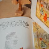 A cosy setup with the Toverlux October silhouette in a wooden lantern by Elsa Beskow available at Babipur.