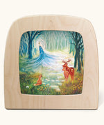 Toverlux Kapitein Kalk - Winter King in Forest Silhouette placed in a magic lamp placed on a table. A beautiful illustration featuring little red hood walking through a forest next to a wolf. 
A range of Toverlux silhouettes, lamps and accessories are available at Babipur.