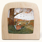 Autumn Lovers Picnic Toverlux Magic Lamp Silhouette. Artwork By Robin-Pieterse. A delicate painting style illustration of 2 people sitting underneath a tree. One of them is reading a book. A range of Toverlux silhouettes, lamp and accessories are available at Babipur.