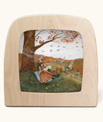 Autumn Lovers Picnic Toverlux Magic Lamp Silhouette. Artwork By Robin-Pieterse. A delicate painting style illustration of 2 people sitting underneath a tree. One of them is reading a book. A range of Toverlux silhouettes, lamp and accessories are available at Babipur.