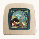 Toverlux magic lamp with a Sibylle Von Olfer Autumn silhouette inside, both available at Babipur. Illustration showing a group of children seeking shelter win a Autumnal scene 