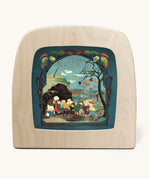 Toverlux magic lamp with a Sibylle Von Olfer Autumn silhouette inside, both available at Babipur. Illustration showing a group of children seeking shelter win a Autumnal scene 