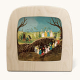 Toverlux magic lamp with a Sibylle Von Olfer spring silhouette inside, both available at Babipur. Illustration showing a group of children carrying flowers underground and above ground.