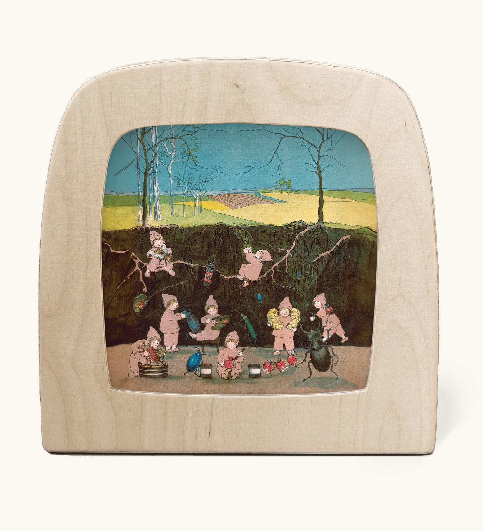 Toverlux magic lamp with a Sibylle Von Olfer Winter silhouette inside, both available at Babipur. Illustration showing a group of children underground cleaning little creatures.