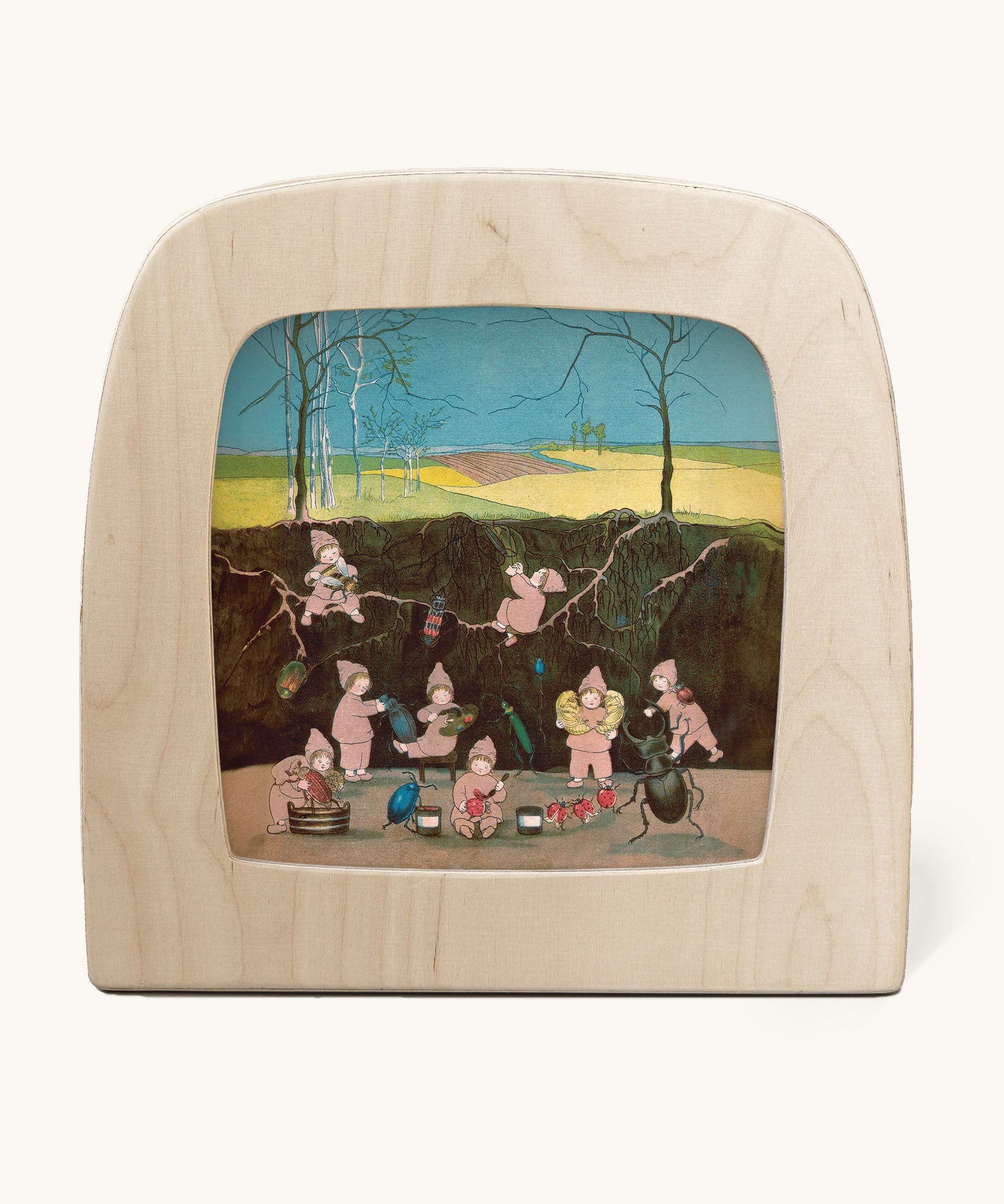 Toverlux magic lamp with a Sibylle Von Olfer Winter silhouette inside, both available at Babipur. Illustration showing a group of children underground cleaning little creatures.