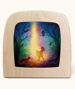 Toverlux magic lamp with a star money forest fairy silhouette by artist Vogel Geluk. A watercolour style illustration of a magical scene featuring a fairy standing in a forest with a ray of starry light shining down on her. A range of Toverlux silhouettes, lamps and accessories are available at Babipur. 