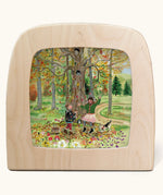 Toverlux Autumn Leaves Delight Toadstools Magic Lamp silhouette by artist Gwen van Knippenberg. A watercolour and pencil style illustration of children dancing under a tree whilst leaves are falling down around them.