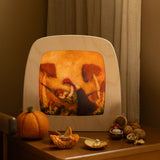 Toverlux Magic Lamp with autumn toadstool artwork by Het Wol Feetje on bedside table with walnuts.