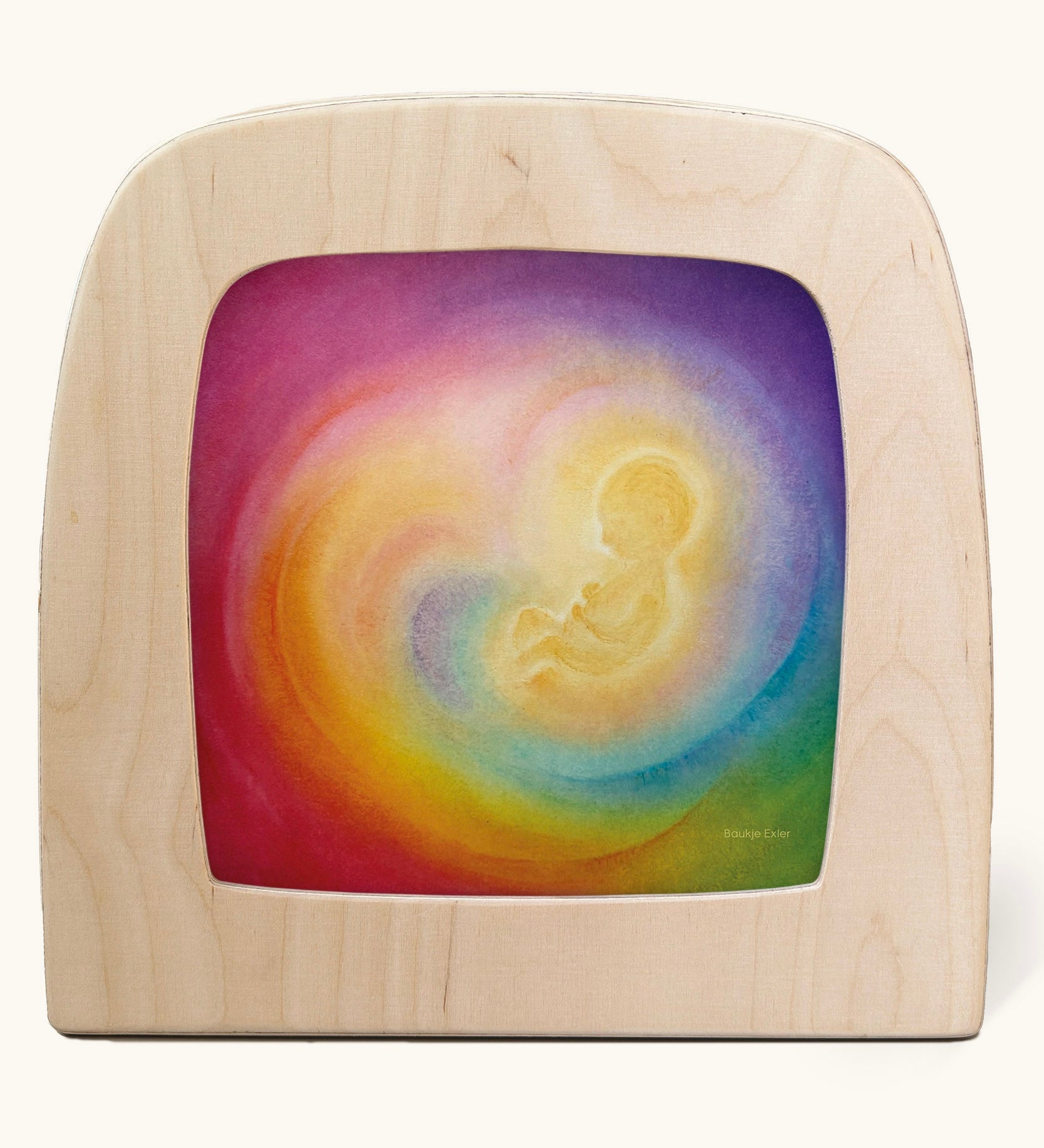 A Toverlux silhouette in the magic lamp with baby in womb rainbow artwork by Baukje Exler. A pastel illustration of a baby in a womb with a dreamy rainbow background.