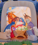 Toverlux nativity scene layered advent story silhouettes available at Babipur surrounded by various Ostheimer wooden nativity figures