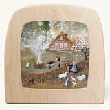 Bonfire Toverlux Magic Lamp silhouette inside a wooden magic lamp. Artwork By Robin-Pieterse. A delicate painting style illustration of a family outside with the father with a wheelbarrow filled with food for a fire. This silhouette is available at Babipur