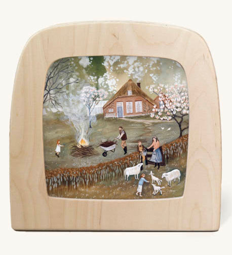 Bonfire Toverlux Magic Lamp silhouette inside a wooden magic lamp. Artwork By Robin-Pieterse. A delicate painting style illustration of a family outside with the father with a wheelbarrow filled with food for a fire. This silhouette is available at Babipur