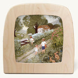 Cow parsley Toverlux Magic Lamp silhouette inside a wooden magic lamp. Artwork By Robin-Pieterse. A delicate painting style illustration of children walking on a country road picking fruit with one feeding a sheep. This silhouette is available at Babipur