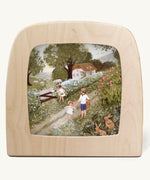 Cow parsley Toverlux Magic Lamp silhouette inside a wooden magic lamp. Artwork By Robin-Pieterse. A delicate painting style illustration of children walking on a country road picking fruit with one feeding a sheep. This silhouette is available at Babipur