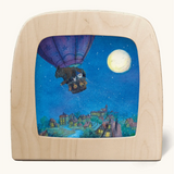 Toverlux silhouette of hot air balloon flying during a full moon, a scene from Daniela Drescher's children's book, Goodnight Sandman.