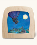 Toverlux silhouette of hot air balloon flying during a full moon, a scene from Daniela Drescher's children's book, Goodnight Sandman.