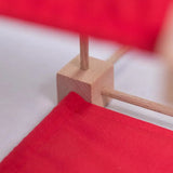 Wooden poles in a corner block of a structure made from the Trigons mini construction set