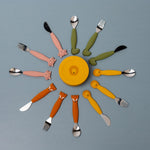 Trixie Animal Friends Silicone Cutlery Set - 3 Pack, spoon, fork and knife arranged in a circle showing the different animal characters.