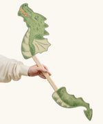 VAH wooden dragon hobby horse toy for child in green, fire-breathing with pointed tail.