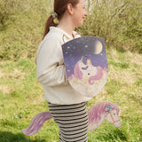 VAH Luna unicorn toy shield in purple with wooden hobby horse toy with purple mane, worn by girl.