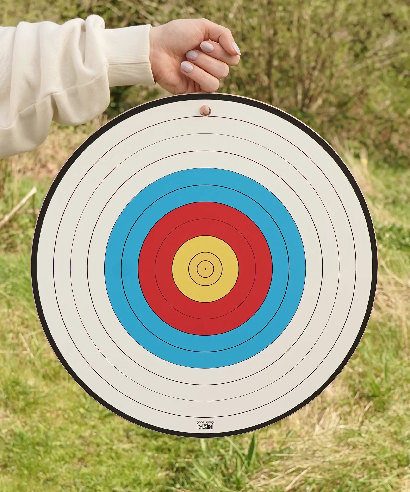 VAH sports target toy, wooden in white with blue red and yellow bullseye, for safety arrows.