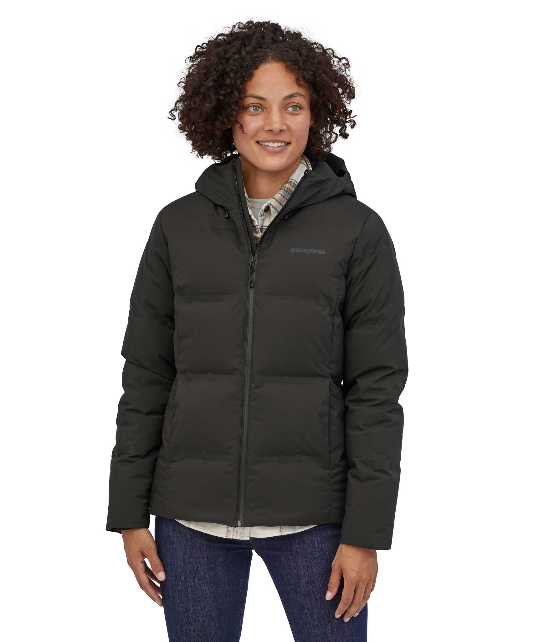 A woman wearing the Patagonia Women's Jackson Glacier Jacket in Black.