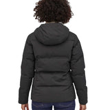 A view of the back of a woman wearing the Patagonia Women's Jackson Glacier Jacket in black.