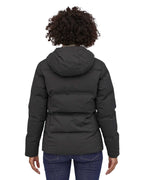 A view of the back of a woman wearing the Patagonia Women's Jackson Glacier Jacket in black.