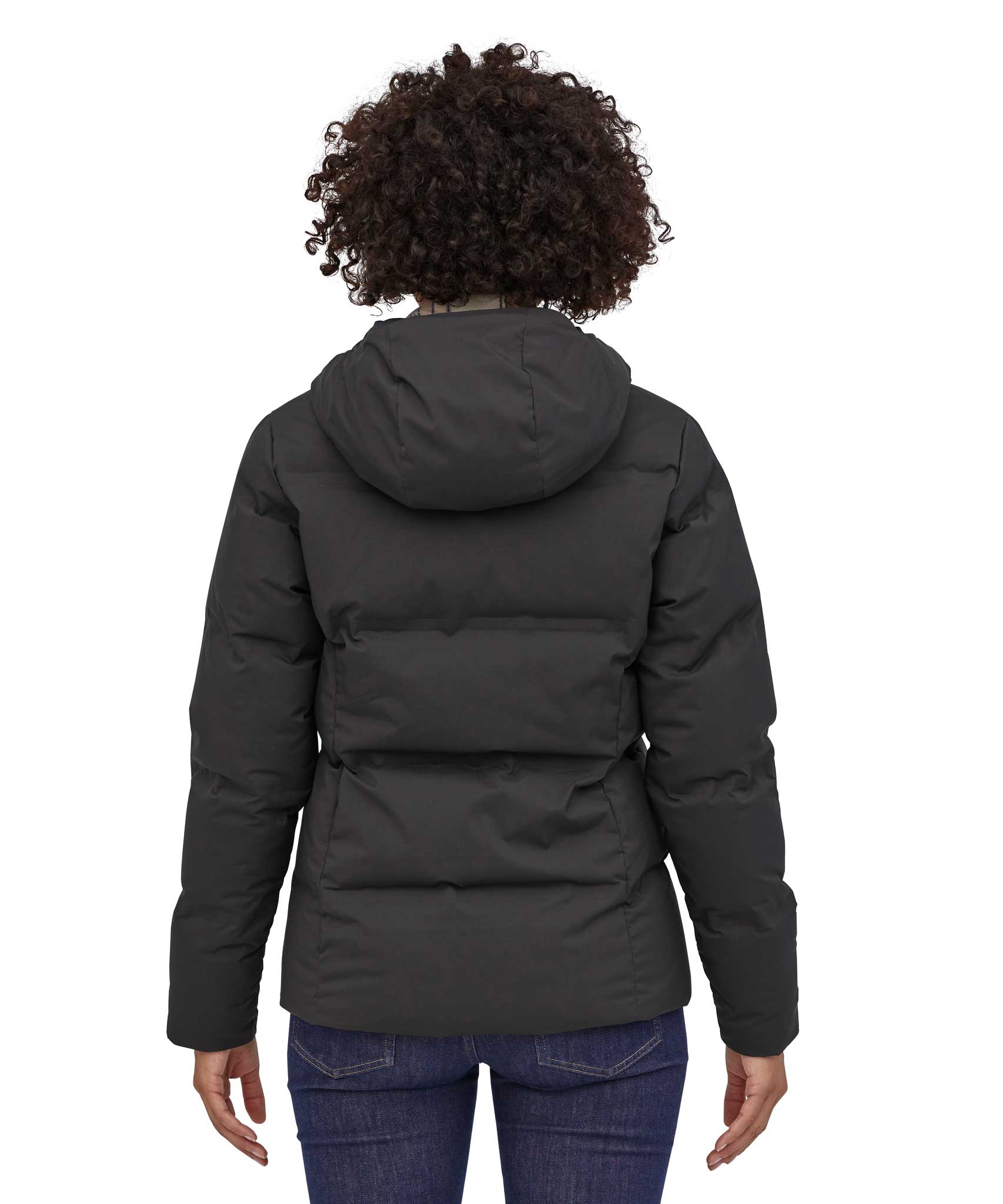 A view of the back of a woman wearing the Patagonia Women's Jackson Glacier Jacket in black.
