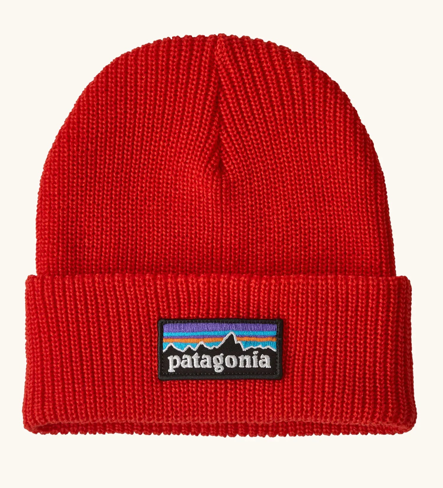 Patagonia Kids Logo Beanie in Sizzle Red. Bright Red Rib knit with a folded cuff and classic Patagonia p-6 logo patch sewn onto the front.