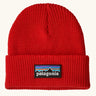 Patagonia Kids Logo Beanie in Sizzle Red. Bright Red Rib knit with a folded cuff and classic Patagonia p-6 logo patch sewn onto the front.