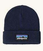 Patagonia Kids Logo Beanie in New Navy. Blue Rib knit with a folded cuff and classic Patagonia p-6 logo patch sewn onto the front.