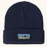 Patagonia Kids Logo Beanie in New Navy. Blue Rib knit with a folded cuff and classic Patagonia p-6 logo patch sewn onto the front.