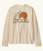 Patagonia Kids organic Long-Sleeved Graphic T-Shirt in Nature's Pace: Undyed Natural. A Beige body with vintage-style Patagonia “Nature’s Pace” snail graphic on the back.