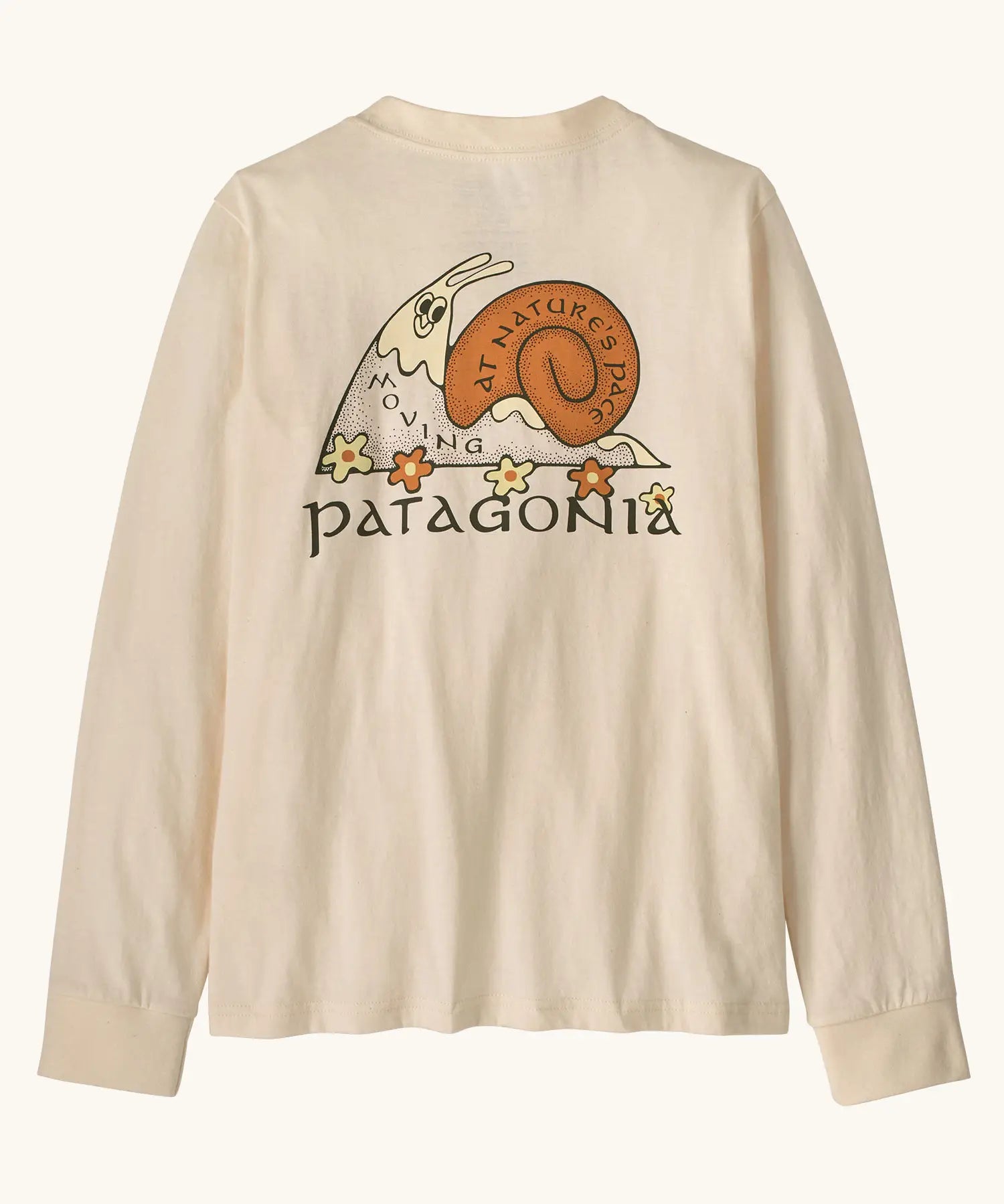 Patagonia Kids organic Long-Sleeved Graphic T-Shirt in Nature's Pace: Undyed Natural. A Beige body with vintage-style Patagonia “Nature’s Pace” snail graphic on the back.