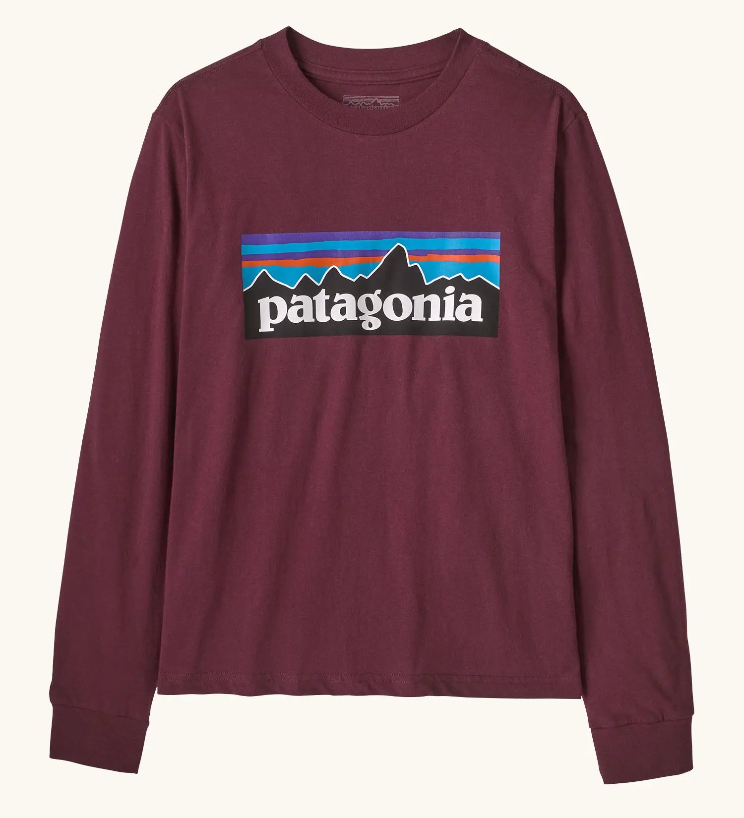 Patagonia Kids Organic Long Sleeve Top in Berry Fig. A Maroon body with classic Patagonia p-6 logo on the chest.