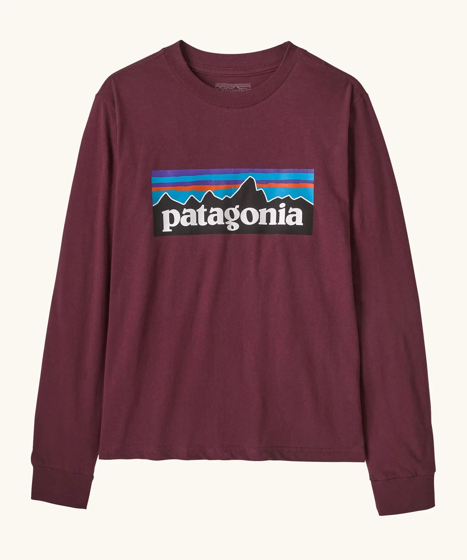 Patagonia Kids Organic Long Sleeve Top in Berry Fig. A Maroon body with classic Patagonia p-6 logo on the chest.