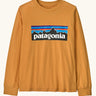 Patagonia Kids Organic Long Sleeve Top in Dried Mango. An orange body with classic Patagonia p-6 logo on the chest.