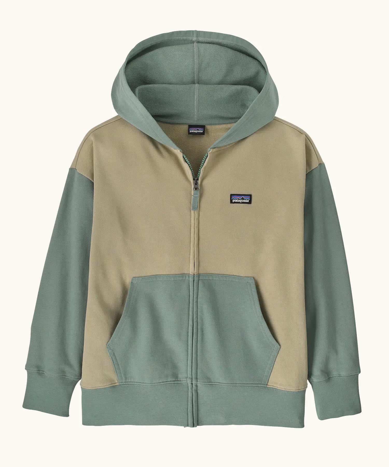 Patagonia Kids Full-Zip Hoody Sweatshirt in weathered stone. Beige body with the classic patagonia p-6 logo patch sewn on one side. Sage green Hood, pockets, waistline and arms. 