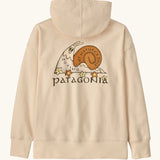 Patagonia Kids Cotton Hoody Sweatshirt in Natural. Undyed beige body with a vintage-style Patagonia “Nature’s Pace” snail graphic logo on the back.