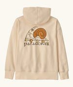 Patagonia Kids Cotton Hoody Sweatshirt in Natural. Undyed beige body with a vintage-style Patagonia “Nature’s Pace” snail graphic logo on the back.