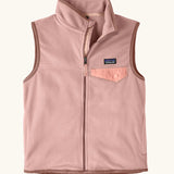 Patagonia Kids Micro D Snap-T Fleece Vest in Fuzzy Mauve. Pale pink fleece body and soft brown binding with a matching chest pocket flap.