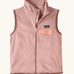 Patagonia Kids Micro D Snap-T Fleece Vest in Fuzzy Mauve. Pale pink fleece body and soft brown binding with a matching chest pocket flap.