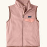 Patagonia Kids Micro D Snap-T Fleece Vest in Fuzzy Mauve. Pale pink fleece body and soft brown binding with a matching chest pocket flap.